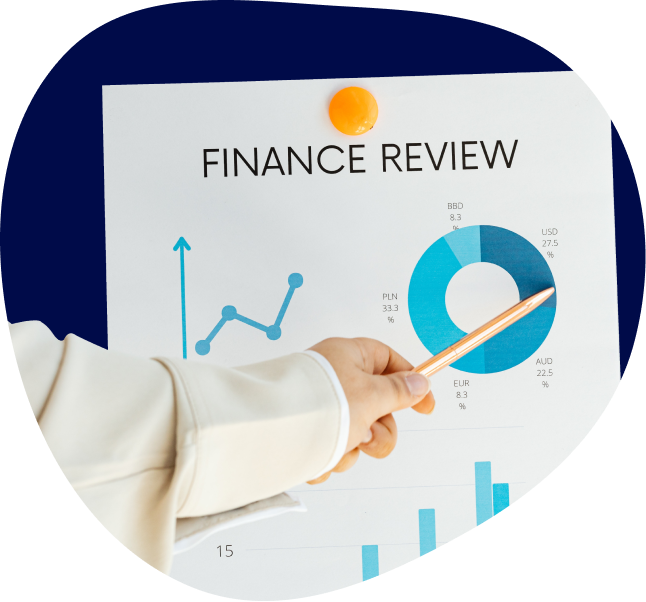 Person pointing at a printout of a finance review.