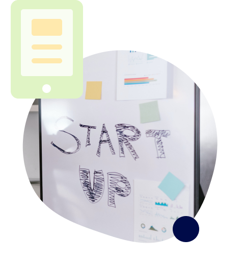 Whiteboard with startup written on it.